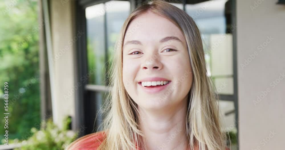 Portrait of a happy caucasian teenager girl at home, slow motion Portrait of a happy caucasian teenager girl at home, slow motion
