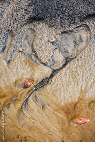 Creative beach sand with small stones © EriksZ