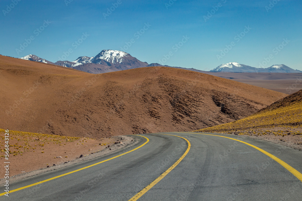 Road in Moon Valley dramatic landscape at Sunset, Atacama Desert, Chile Road in Moon Valley dramatic landscape at Sunset, Atacama Desert, Chile