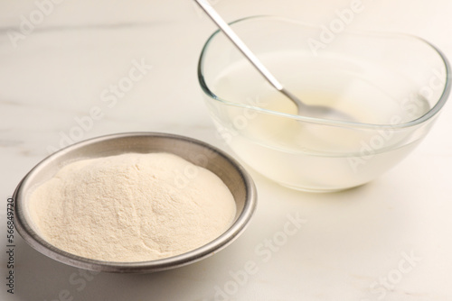 Agar-agar jelly and powder on white table, closeup