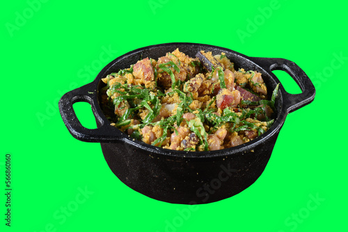 tropeiro beans with flour bacon cabbage sausage calabresa in iron pan typical brazilian food isolated on green background chroma key