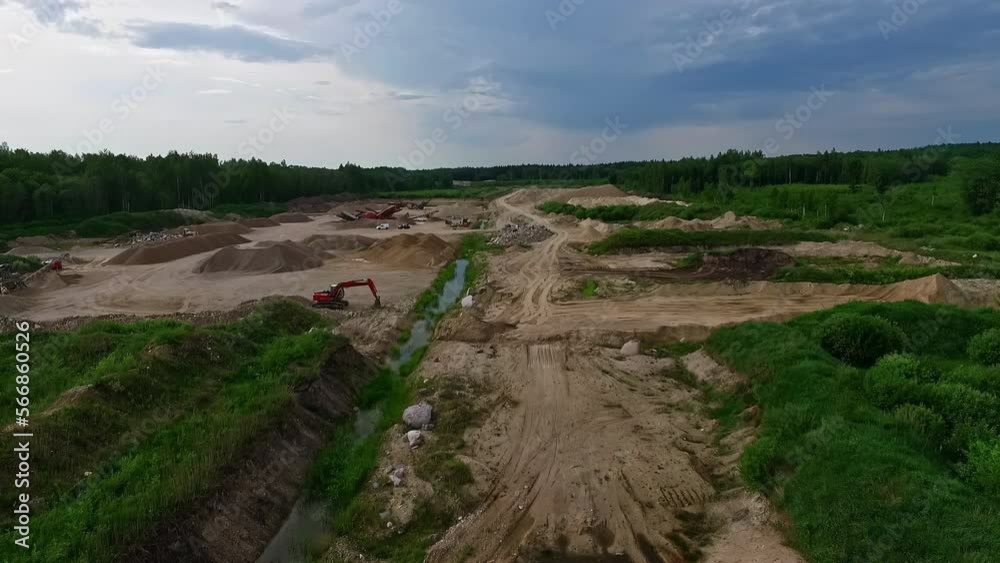 Sand quarry in countryside. Aerial backward