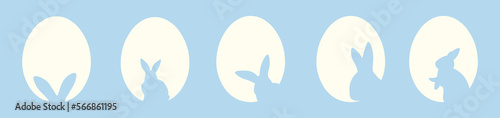 Many silhouettes of bunnies and Easter eggs on blue background