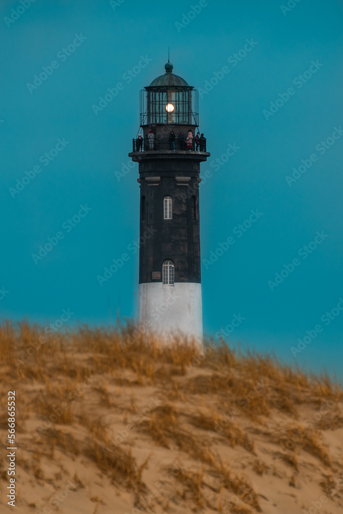 The Fire Island Lighthouse  on the Great South Bay,  Long Island, New York,  with observers on the top of the lighthouse 