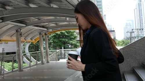 Wallpaper Mural Business woman using smartphone shopping online, call, texting message internet technology lifestyle. Asian woman using cellphone walking on city street. Smart phone smart confident woman modern city Torontodigital.ca