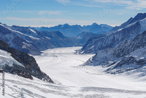 Alpine mountains surround a snowy glacial basin at Jungfraujoch