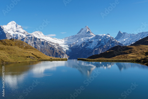 Bachalpsee lake near First, Switzerland with snowy alpine range reflected in the water