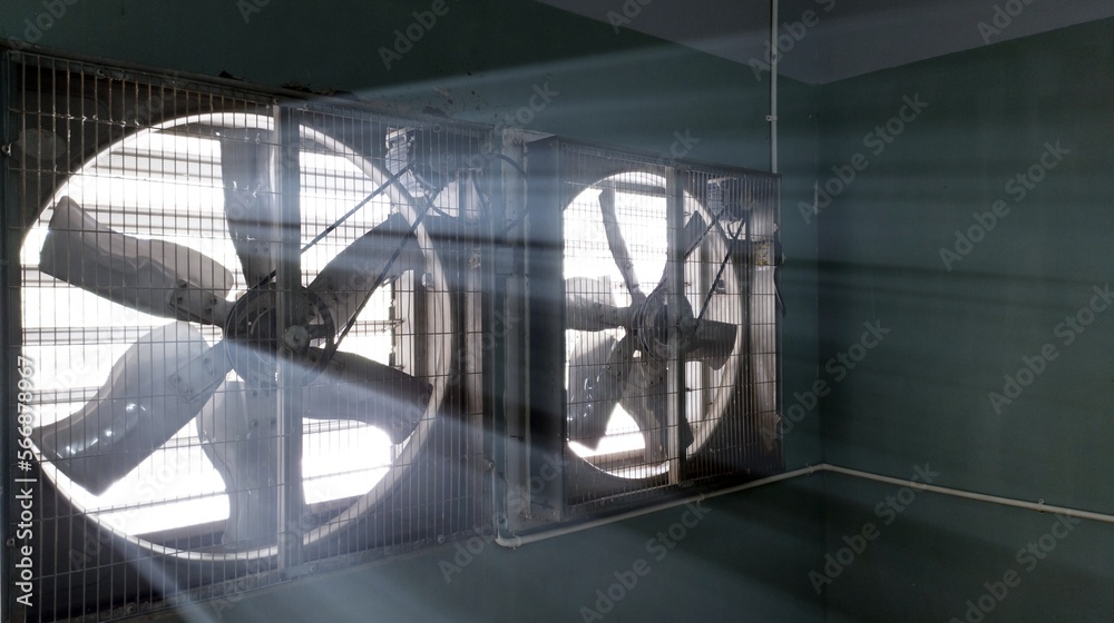Big industrial Exhaust fan in a factory. Ventilation of plant building.  With Shiny light. Stock Photo | Adobe Stock