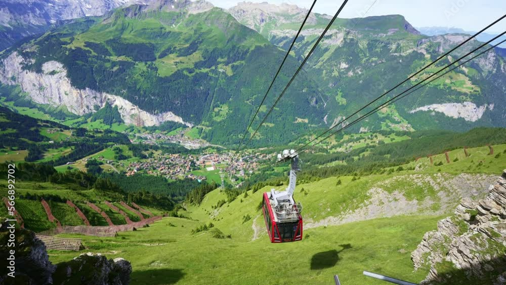 cable car gondola, Mannlichen in Swiss Alps, trail to Kleine Scheidegg, beautiful hike in Jungfrau region, Bernese Oberland in Switzerland.