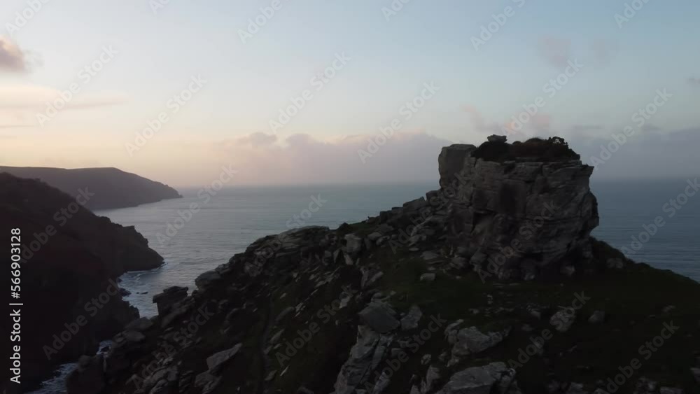 Beautiful Panning Aerial Drone Shot at Sunset with Cliff Top Rocks and Dramatic Coastline and Sea at Valley of Rocks UK 4K Beautiful Panning Aerial Drone Shot at Sunset with Cliff Top Rocks and Dramatic Coastline and Sea at Valley of Rocks UK 4K