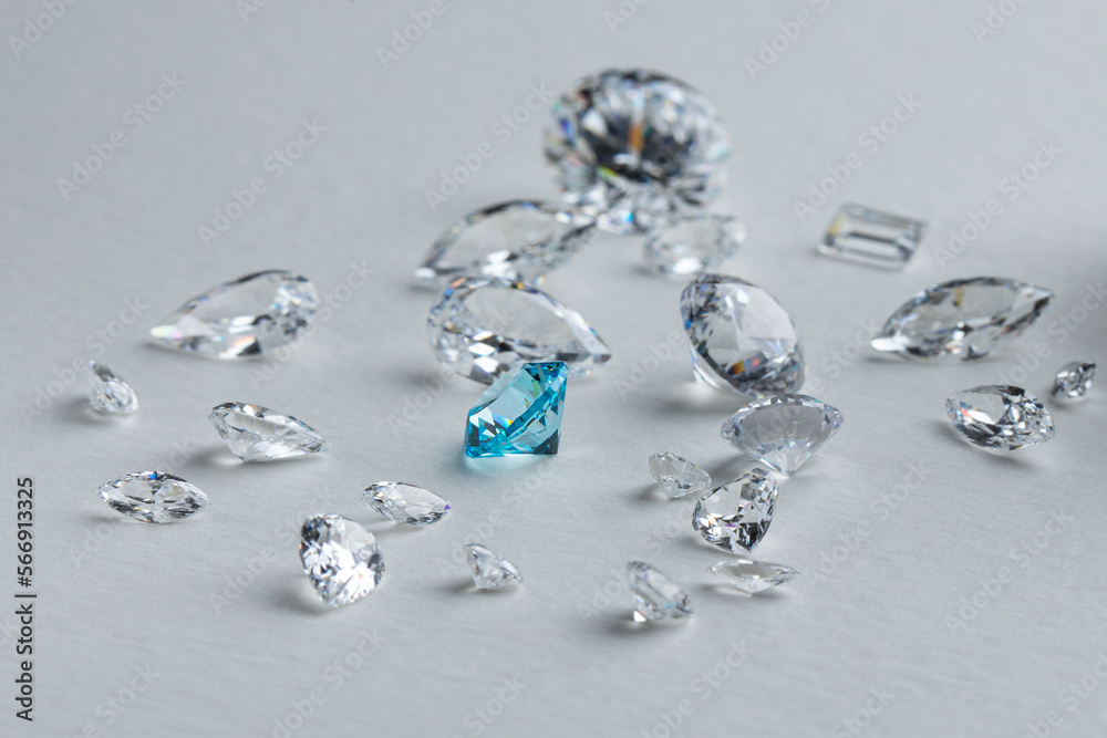 Coloured diamonds of different sizes at the workplace of a diamond expert sorting. High quality photo