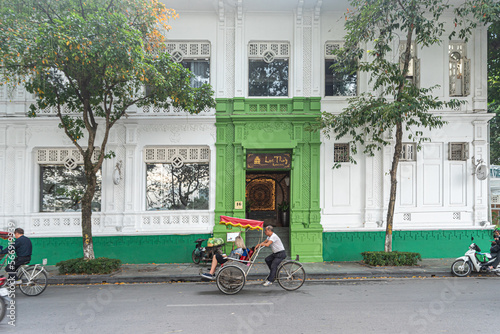 Streets of Hanoi in a cloudy day, people, transportation and food around this beautiful city.