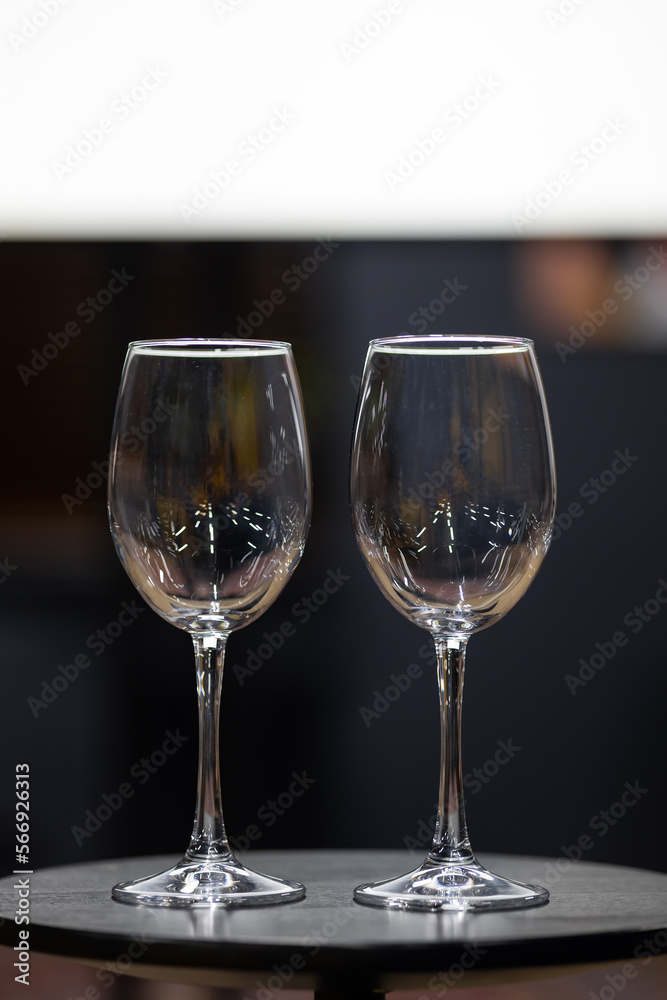 Two empty wine glasses on the table. There are no people. Copy Space