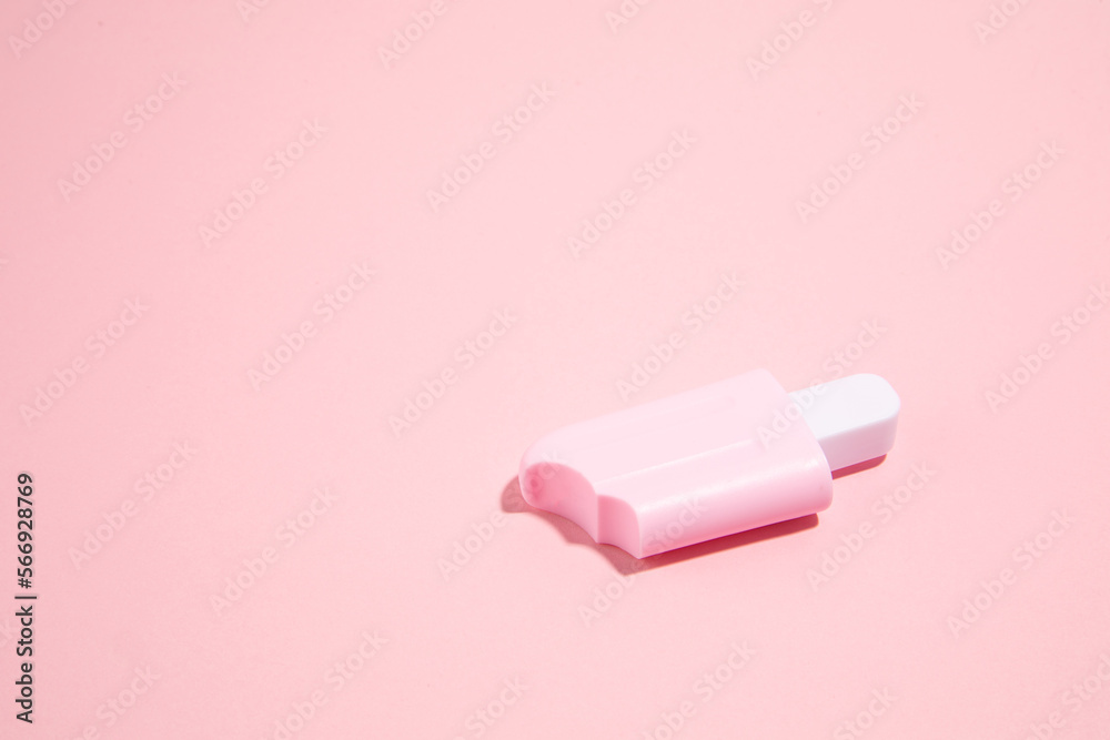 Pink ice cream toy made from plastic on pink background with copy space Pink ice cream toy made from plastic on pink background with copy space