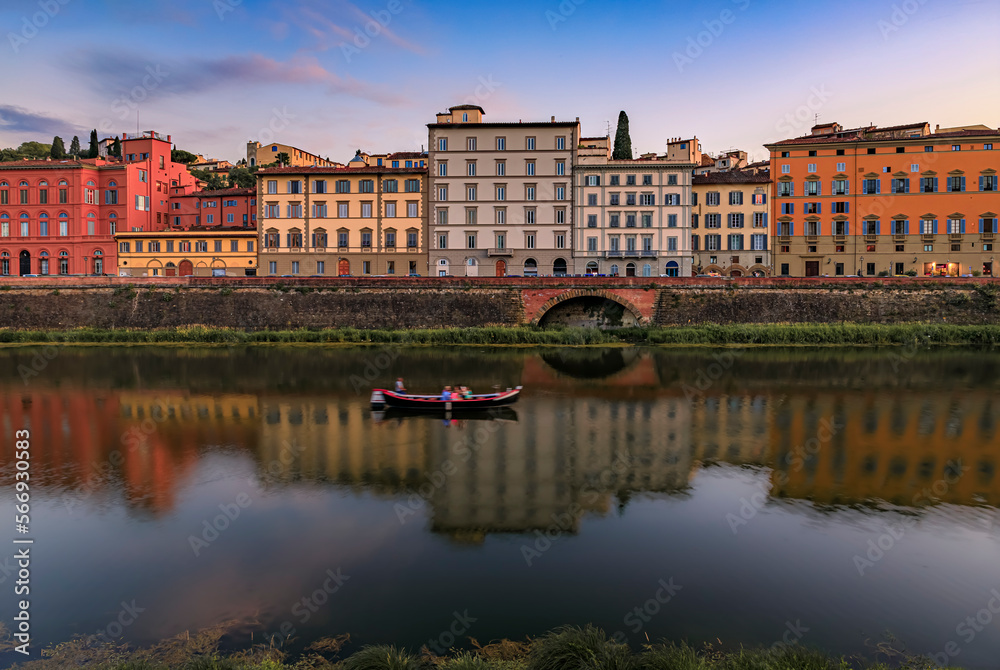 Sunset cityscape with waterfront houses on Arno River, Florence, Italy