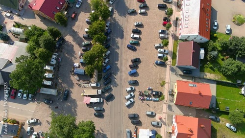 Busy streets of Sveksna town with local market on sunny day, aerial top down view photo