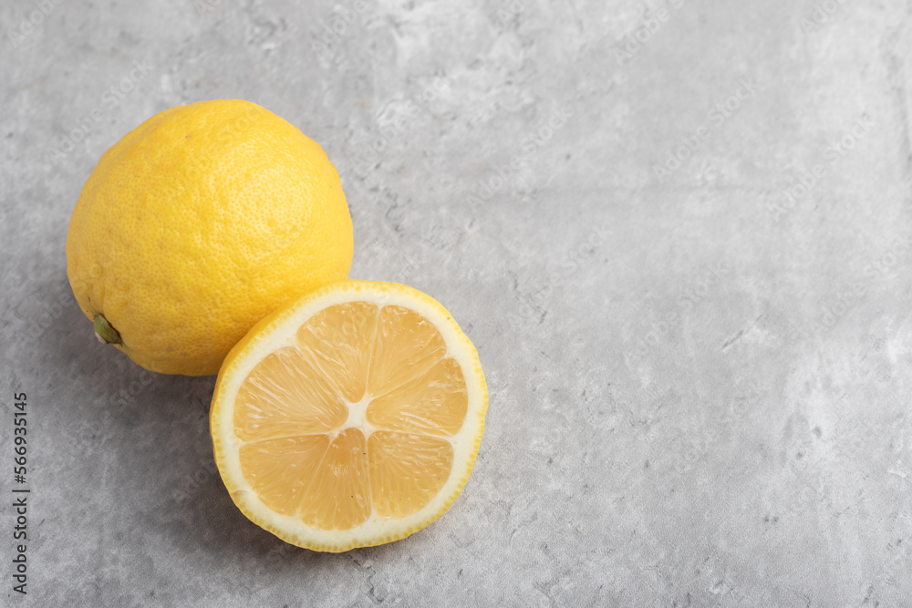 yellow lemons on a gray background yellow lemons on a gray background