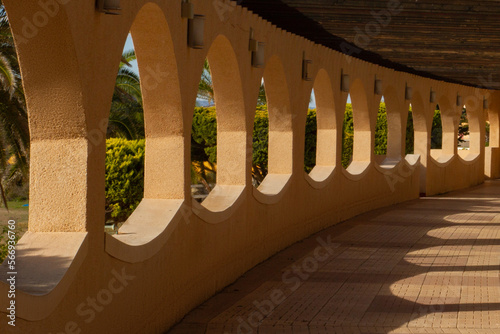 semicircular arch with round windows overlooking the sea photo