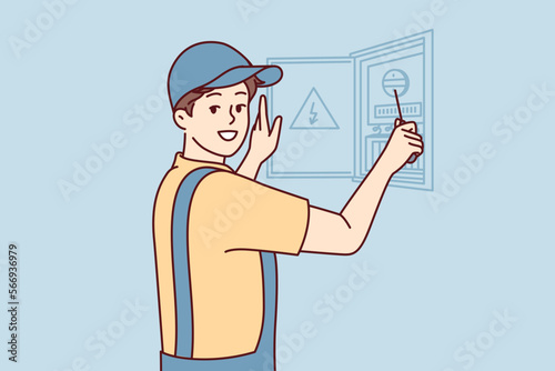 Man electrician is engaged in repair electrical appliances by opening electrical panel. Guy repairman in cap and in overalls carries out installation wiring after major overhaul. Flat vector design 