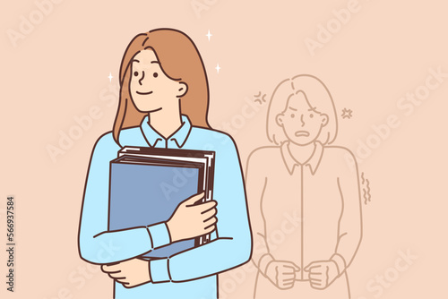 Happy woman office worker standing with folders near angry woman located behind