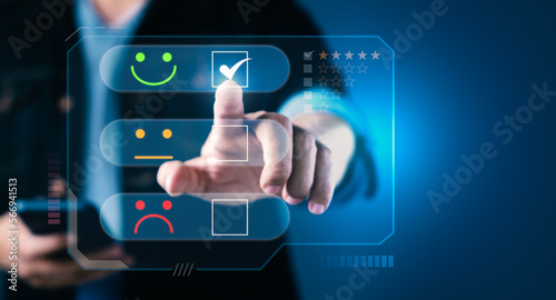 Man hand pressing virtual screen with smiling face icons to giving level excellent rank