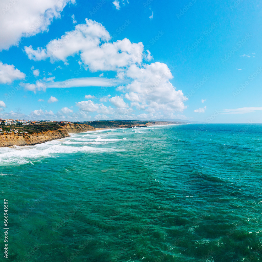 Beautiful oceanscape with skyline, ocean rocky coastline. Drone view over beaches, coastlines in Ericeira, Portugal, on summer sunny day. Aerial view to the Beautiful European touristic town.