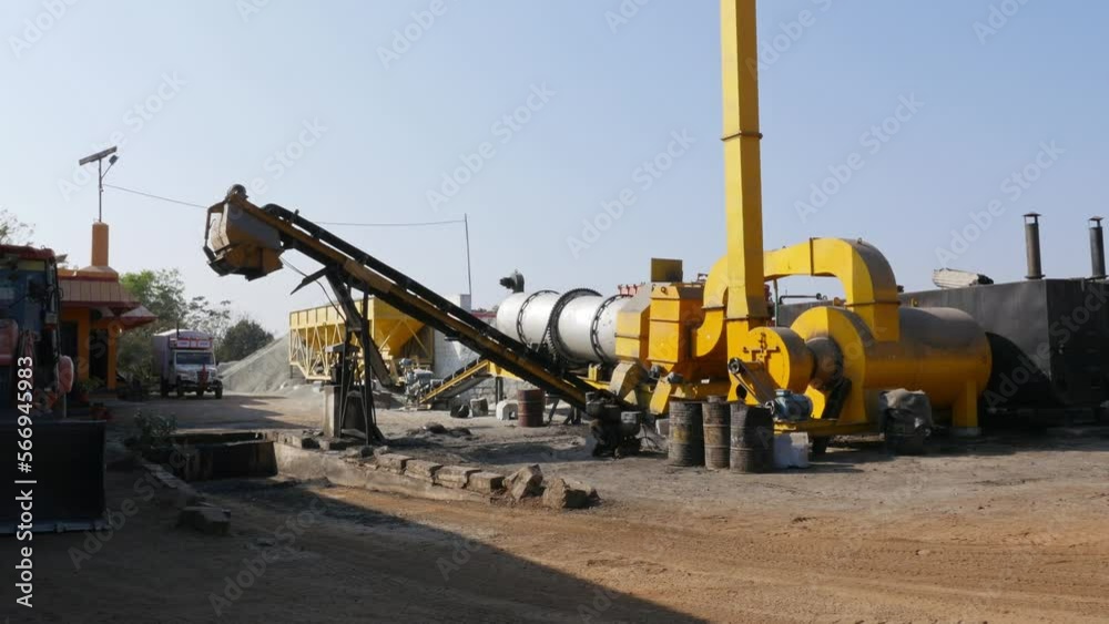 A wide view of the asphalt production factory with machines A wide view of the asphalt production factory with machines