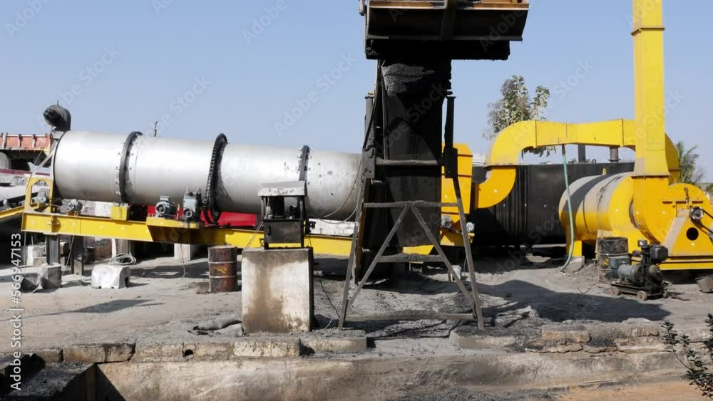 A wide view of the asphalt production factory with machines A wide view of the asphalt production factory with machines