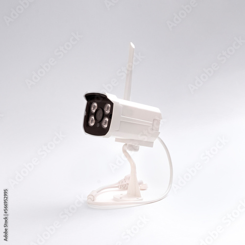 The surveillance camera is isolated on a white background. Street surveillance camera. Indoor surveillance camera. Video camera for the protection of order/