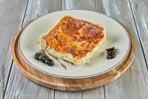 Quiche with cheese cooked in light peas. French gourmet cuisine