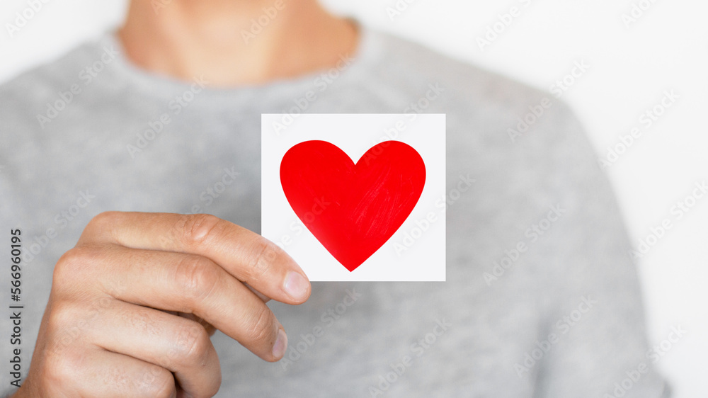 Man holding a red heart. Romantic man. Message. Love. The senses. Man holding a red heart. Romantic man. Message. Love. The senses.
