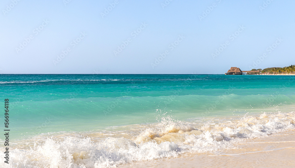 Kendwa tropical beach in Zanzibar island and turquoise waters of Indian ocean. Summer holiday destination background with copy space.