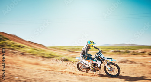 Fototapeta Naklejka Na Ścianę i Meble -  Motorbike, motorsports and speed on dunes with power, sky mockup and offroad path. Driver, motorcycle and travel on dirt track, sand and adventure course for fast action, freedom or rally performance