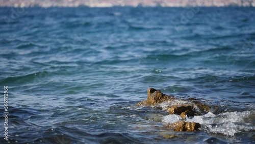 Ein Tag am Meer mit kleines Felsenformation im Wasser - a day at the sea with small rocks in the water photo