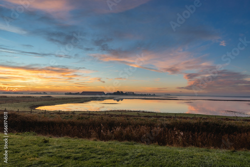 Beautiful sunrise over the dutch countryside. Den Osse, Zeeland, The Netherlands. © Sonny