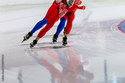 Obraz na plátně two male speed skaters running in ice ring