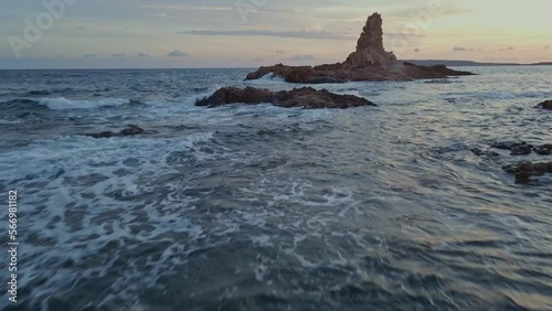 Fpv view of reddish Cala Pregonda mediterranean sea Spain  photo