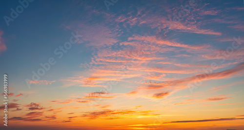 The sky before dawn, orange clouds on the background of the blue sky.