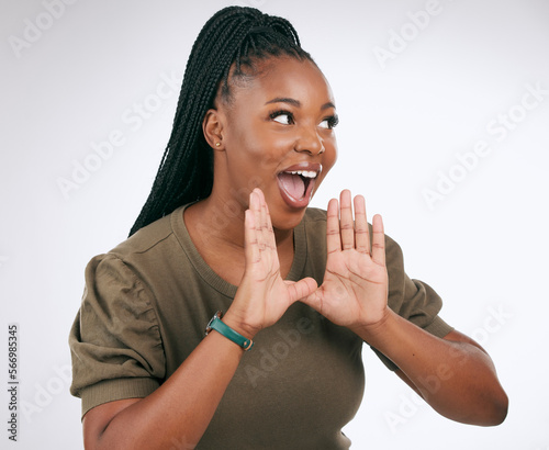 Wow, announcement and excited with a black woman in studio on a gray background to share news. Hands, promotion and information with a young female indoor sharing a secret as a brand ambassador photo