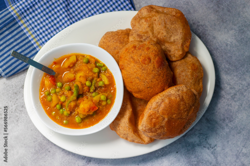 delicious Indian food "Matar ki Sabji aur poori". Green pea potato