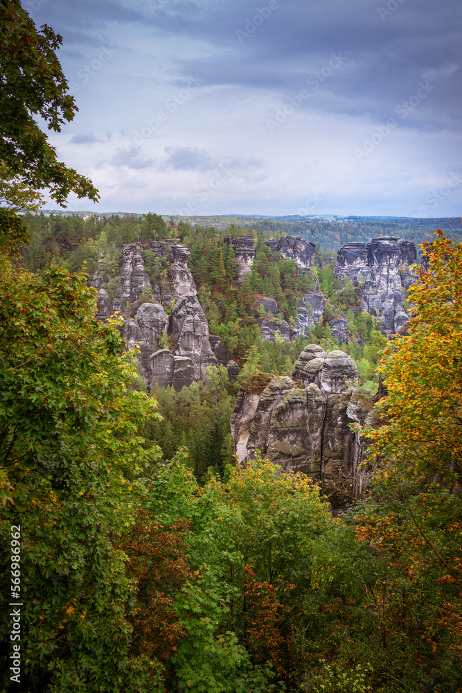 Obraz premium Panoramic birdview over monumental Bastei sandstone pillars near Kurort Rathen village in the national park Saxon Switzerland by Dresden and Elbe river, Saxony, Germany