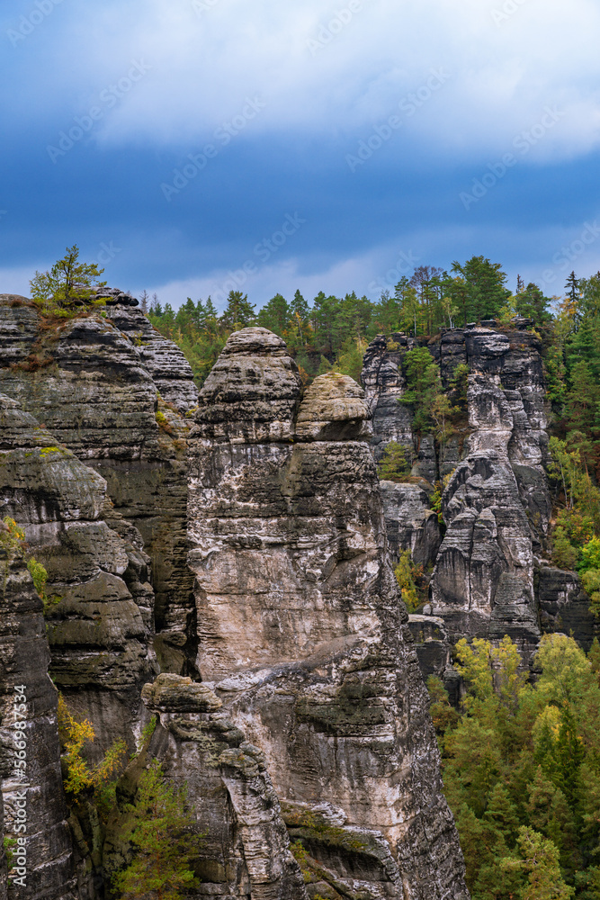 Panoramic birdview over monumental Bastei sandstone pillars near Kurort Rathen village in the national park Saxon Switzerland by Dresden and Elbe river, Saxony, Germany Panoramic birdview over monumental Bastei sandstone pillars near Kurort Rathen village in the national park Saxon Switzerland by Dresden and Elbe river, Saxony, Germany