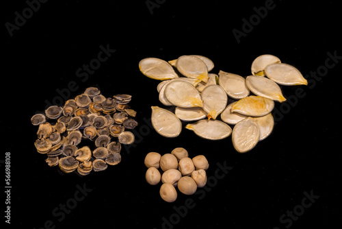 Different sort of seeds on a black background.