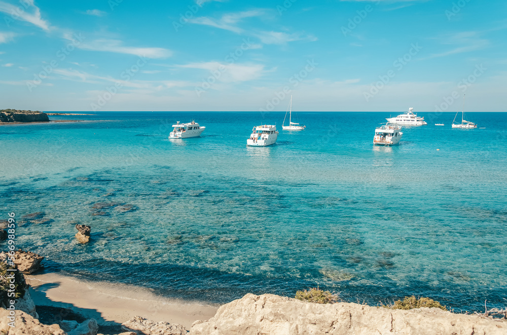Tourist boats are mooring at Blue lagoon at Akamas peninsula on Cyprus Tourist boats are mooring at Blue lagoon at Akamas peninsula on Cyprus