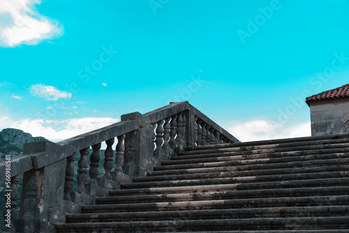 ancient stone stairs goe to blue sky, old european style in croatia dubrovnik kolomac town