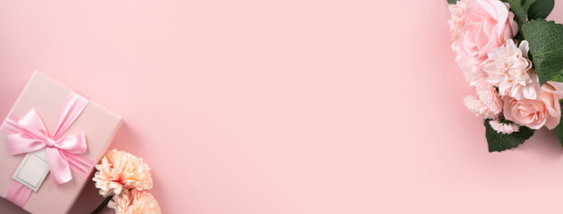 Valentine's Day and Mother's Day design concept background with pink flower and gift on pink background.