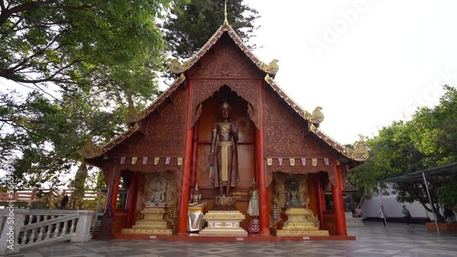 Wooden Standing Buddha Within The Wat Phra That Doi Suthep, Theravada Buddhist Temple In Chiang Mai Province, Thailand. - wide photo