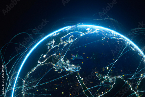 Planet Earth in blue light with Communication technology network connections, data transfer between cities and continents, internet network around the world from space