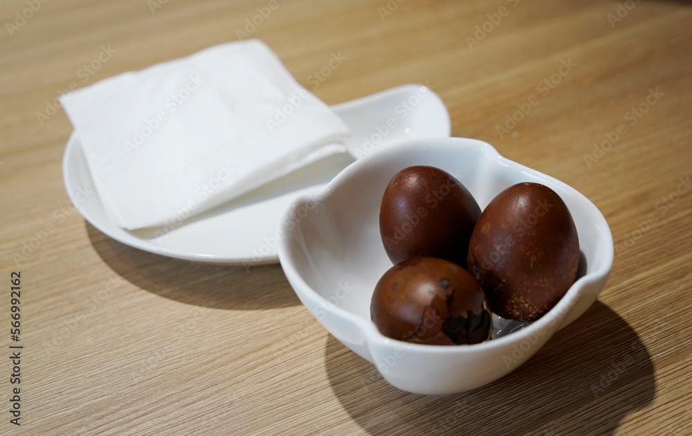 Signature tea infused boiled eggs in Kuala Lumpur cafe, Malaysia                                                             