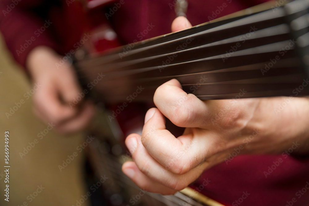 Man Playing Double Neck Fretless Guitar Man Playing Double Neck Fretless Guitar